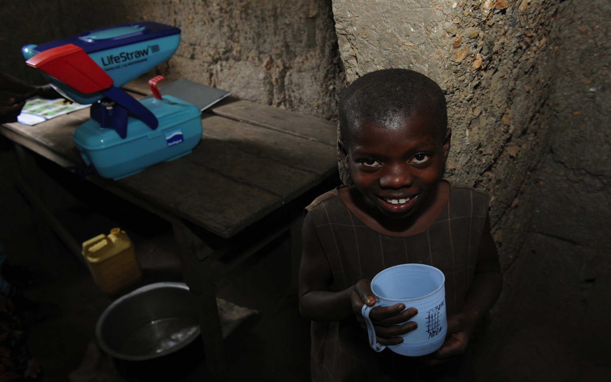 Child with LifeStraw filter